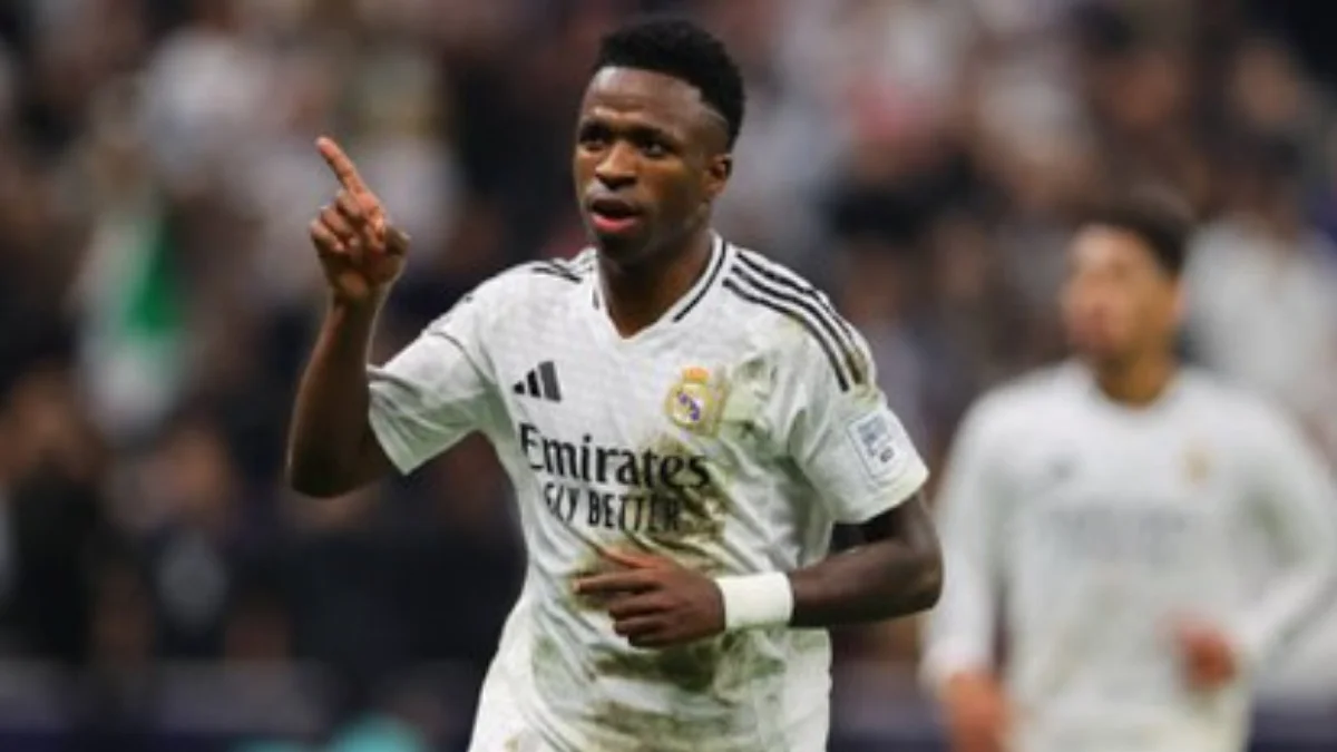 Vinicius Jr Brilliant Goal Powers Real Madrid to 2-1 Win Over Mallorca as he celebrates in iconic white jersey.