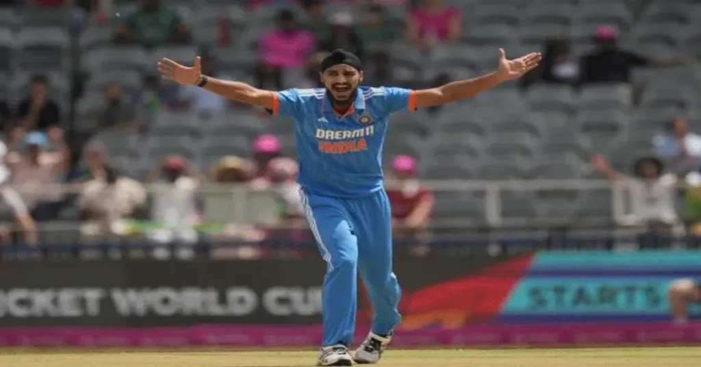 Arshdeep Becomes First India Bowler to Reach 100 T20I Wickets celebrating milestone in cricket match.