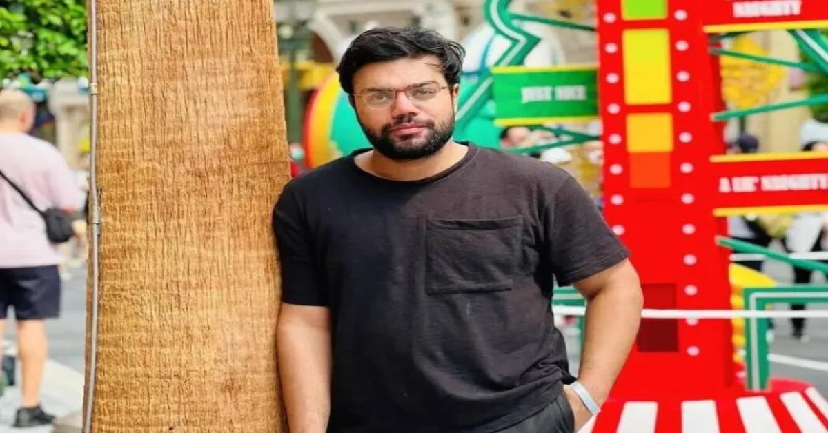 Ducky Bhai standing outdoors in casual clothes amid colorful surroundings – Ducky Bhai Case Update Today photo.