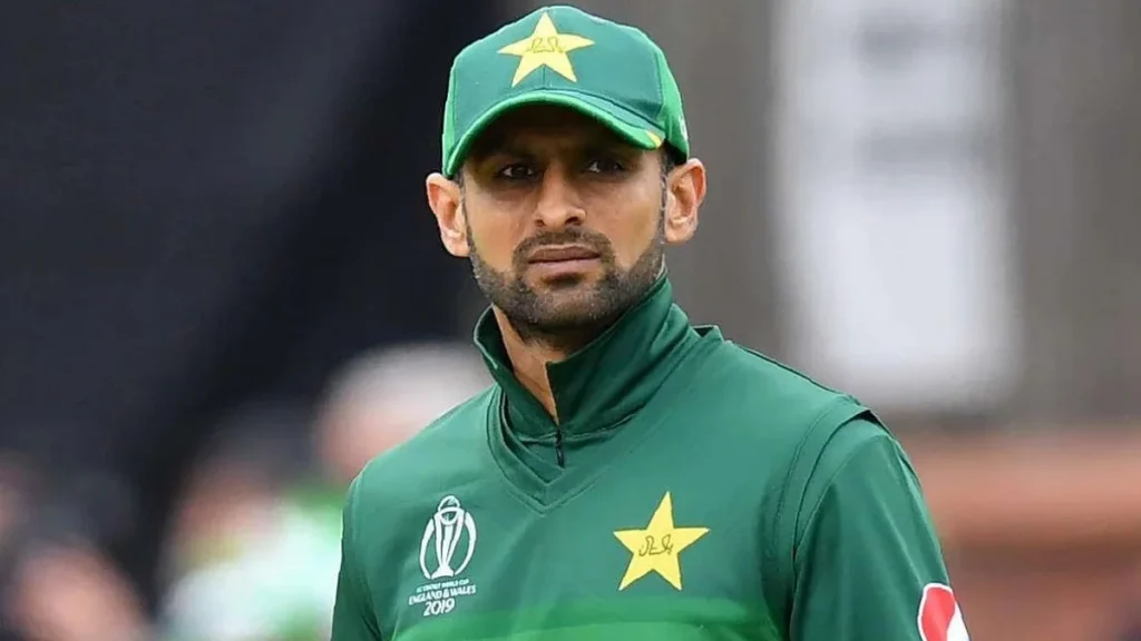 Shoaib Malik in his Pakistan cricket team uniform, focusing on the field after his divorce with Sana Javed.